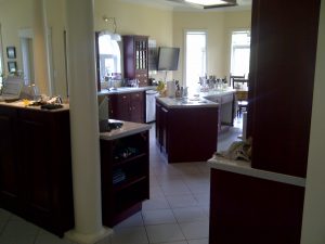 Renovations often take on a life of their own. In this case, a general desire to upgrade a dated kitchen (left) also turned into the installation of a new  alternative floor (see  cover above).